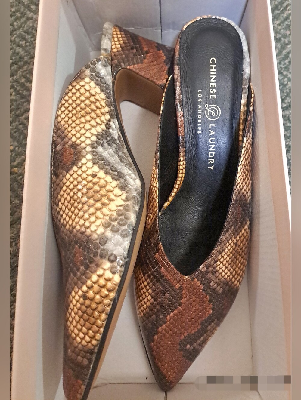 Chinese Laundry Pollie mules featuring a yellow and brown snake print leather.